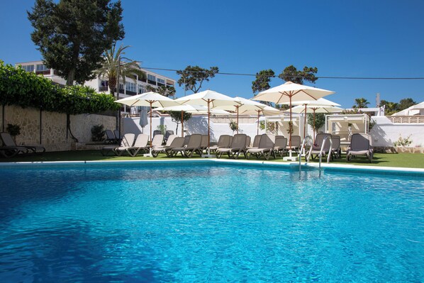 Seasonal outdoor pool, pool umbrellas, pool loungers
