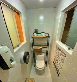 Standard Room | Bathroom | Shower, hair dryer, soap, toilet paper