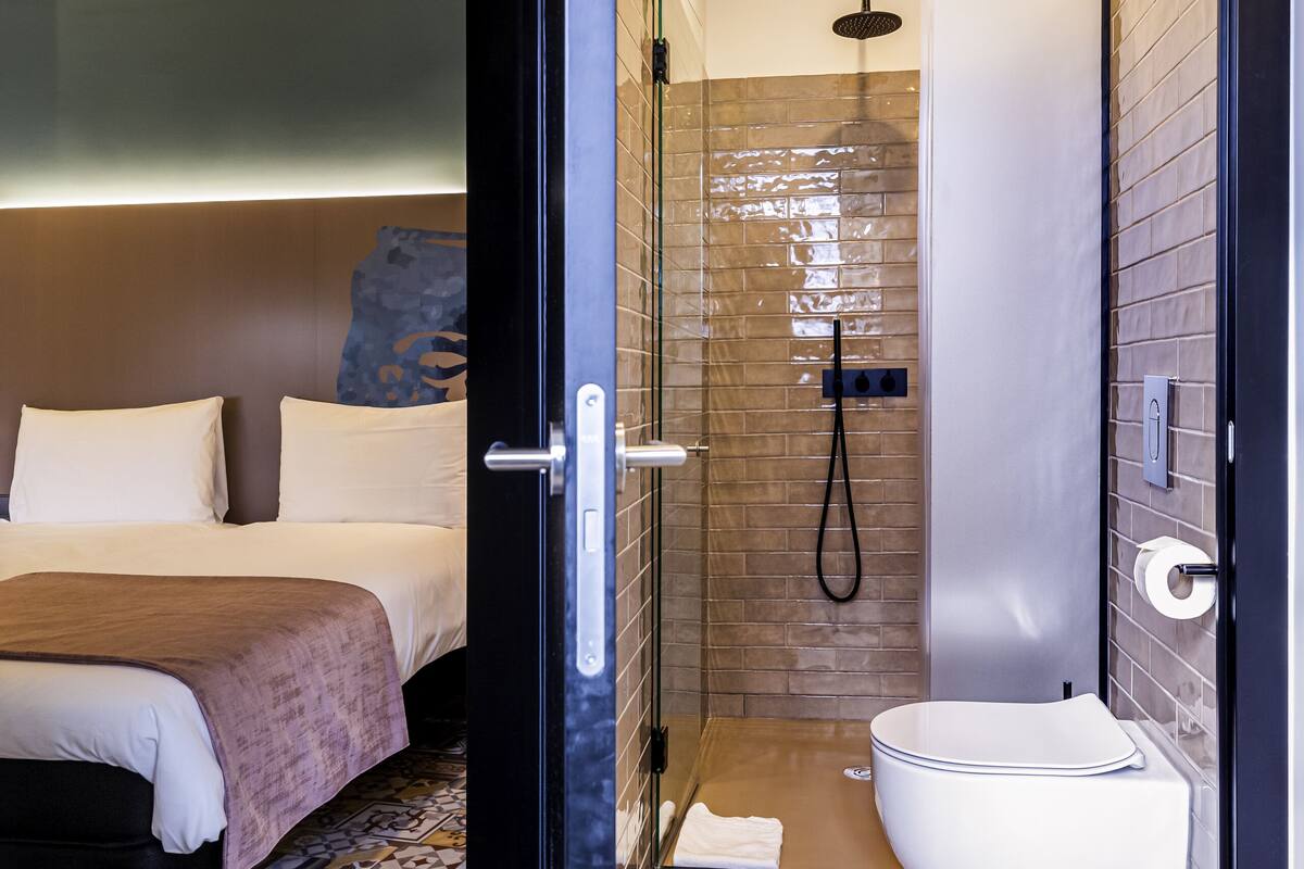 room, 3 single beds | bathroom | shower, rainfall showerhead, eco-friendly toiletries, hair dryer