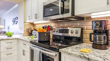 Condo, 1 King Bed with Sofa bed (Beachfront condo with huge views/pool) | Private kitchen | Fridge, microwave, oven, stovetop