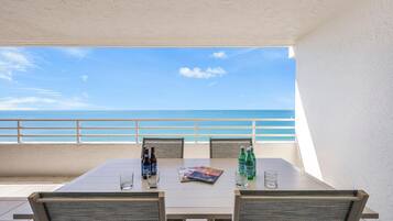 Condo, 1 King Bed with Sofa bed (Beachfront condo with huge views/pool) | Outdoor dining