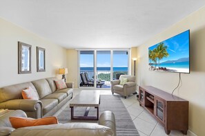 Condo, Multiple Beds (Stylish beachfront condo with pool an) | Living area | Flat-screen TV - Stylish Beachfront Condo With Pool and Ocean Views (Marco Island)