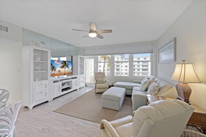 Condo, 2 Queen Beds (Cozy beachfront condo with pool and o) | Living area | Flat-screen TV