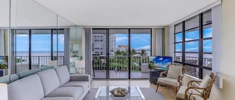 Condo, 1 King Bed (Front unit facing beach with wraparou) | Living room | Flat-screen TV
