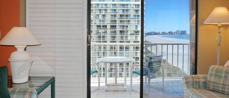 Condo, Multiple Beds (Alluring beachfront condo with pool a) | Living area | Flat-screen TV