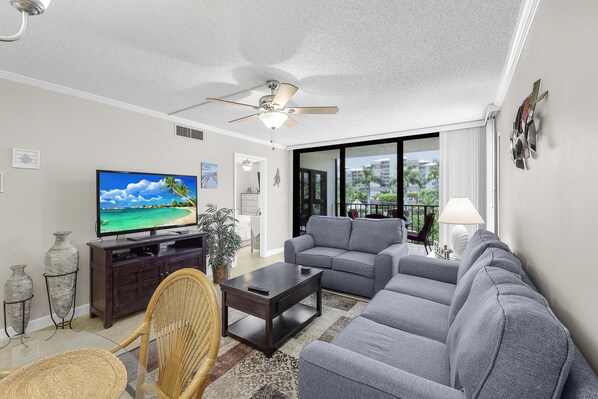 Condo, 1 Queen Bed with Sofa bed (Stylish condo across from South Beach) | Living area | Flat-screen TV