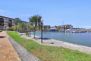 Enjoy waterfront views of the marina from our hotel, where you can walk along the brick-lined path surrounded by palm trees.