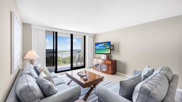 Condo, 1 King Bed with Sofa bed (Alluring beachfront condo with pool a) | Living area | Flat-screen TV
