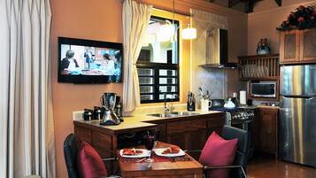 Fridge, microwave, coffee/tea maker, cookware/dishes/utensils