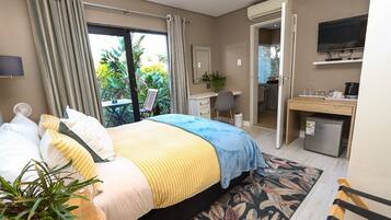 Quarto conforto | Frigobar, quartos à prova de som, Wi-Fi de cortesia, roupa de cama