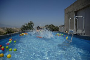 Outdoor pool, open 10:00 AM to 9:00 PM, pool umbrellas, sun loungers
