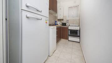 Apartment | Private kitchen | Full-size fridge, microwave, oven, stovetop