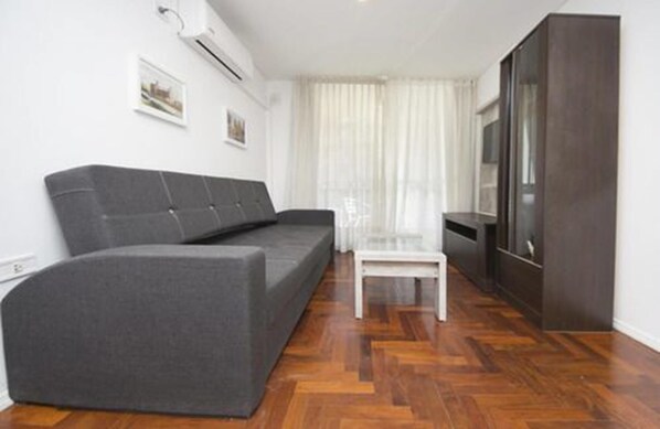 Standard Apartment | Living area | 32-inch LED TV with cable channels, TV