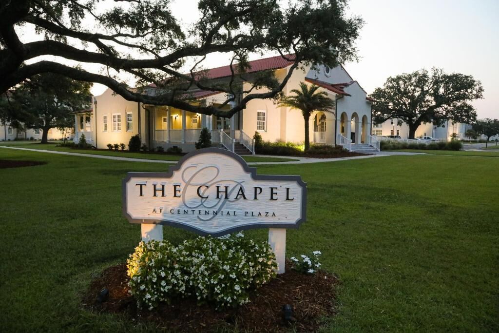 A building with a sign that reads 'The Chapel at Centennial Plaza.'