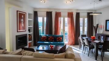Apartment, 1 Bedroom | Living room | Flat-screen TV