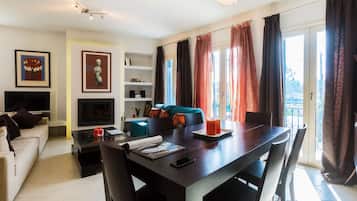 Apartment, 1 Bedroom | Living room | Flat-screen TV