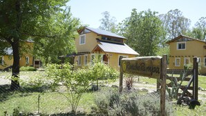 A yellow building with a sign reading "Rancho Pampa."