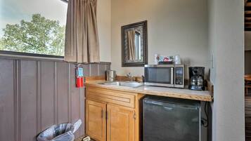 Fridge, microwave, coffee/tea maker, cookware/dishes/utensils