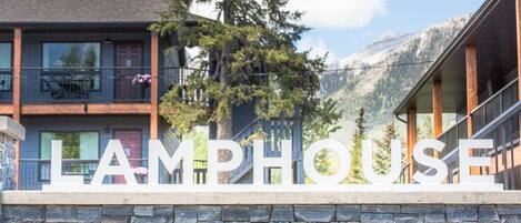 A hotel sign with the word 'LAMPHOUSE' in large letters.