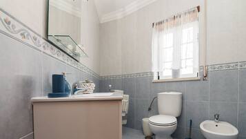 Bathtub, hair dryer, towels