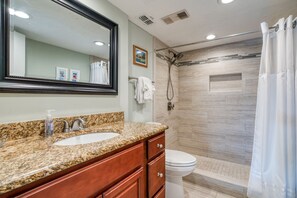 Shower, hair dryer, towels, toilet paper