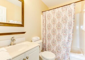 Combined shower/bathtub, hair dryer, towels, toilet paper