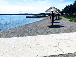 Stroll along the waterfront promenade, where a shaded gazebo awaits.