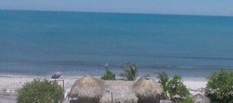 RED MOON HOUSE IN FRONT OF THE SEA