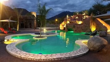 Seasonal outdoor pool, open 11:00 AM to 10:00 PM, pool umbrellas