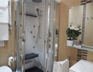 Room, Multiple Beds | Bathroom | Hydromassage showerhead, hair dryer, bidet, towels