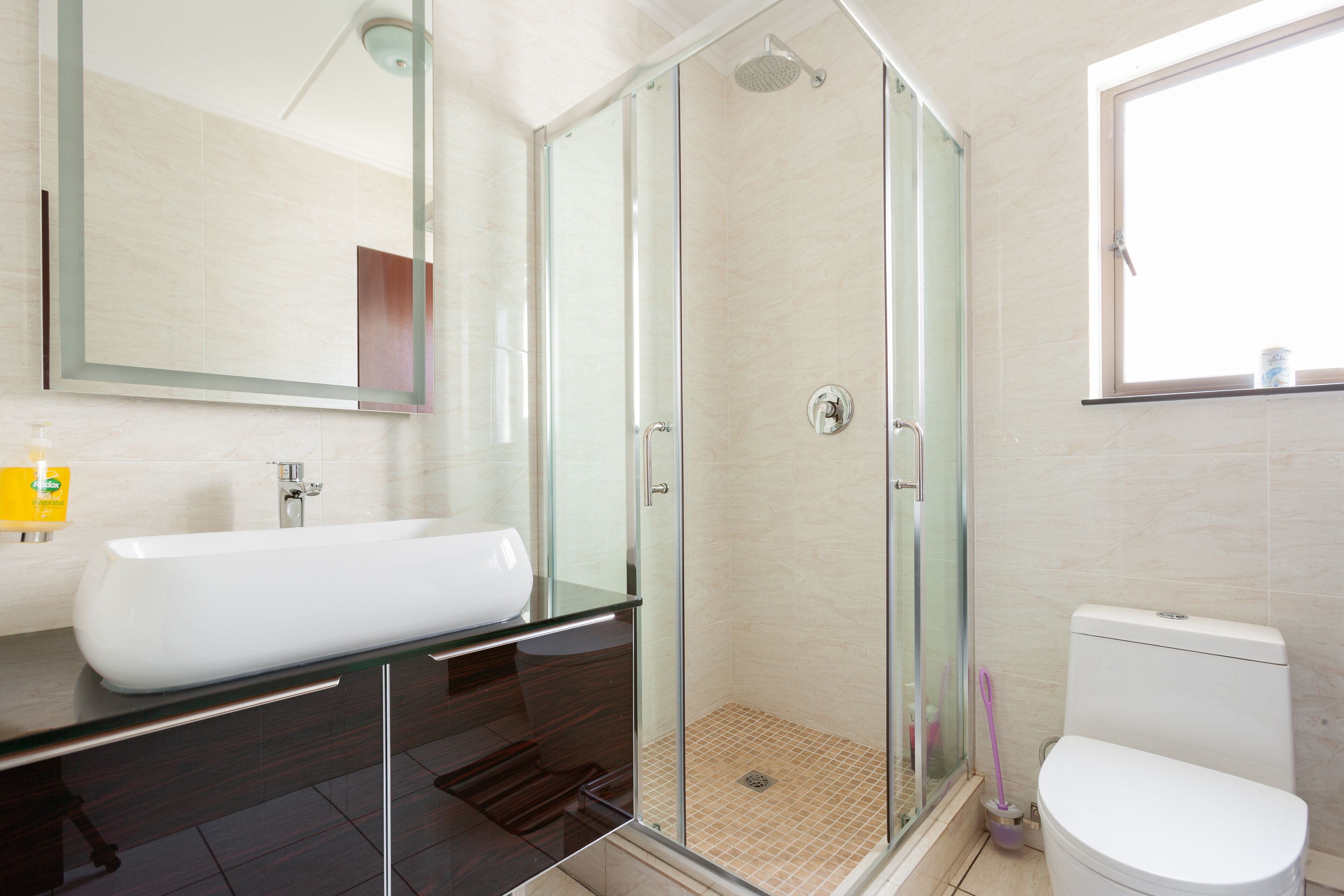 Bathtub, towels, soap, toilet paper