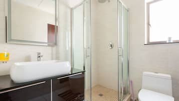 Bathtub, towels, soap, toilet paper