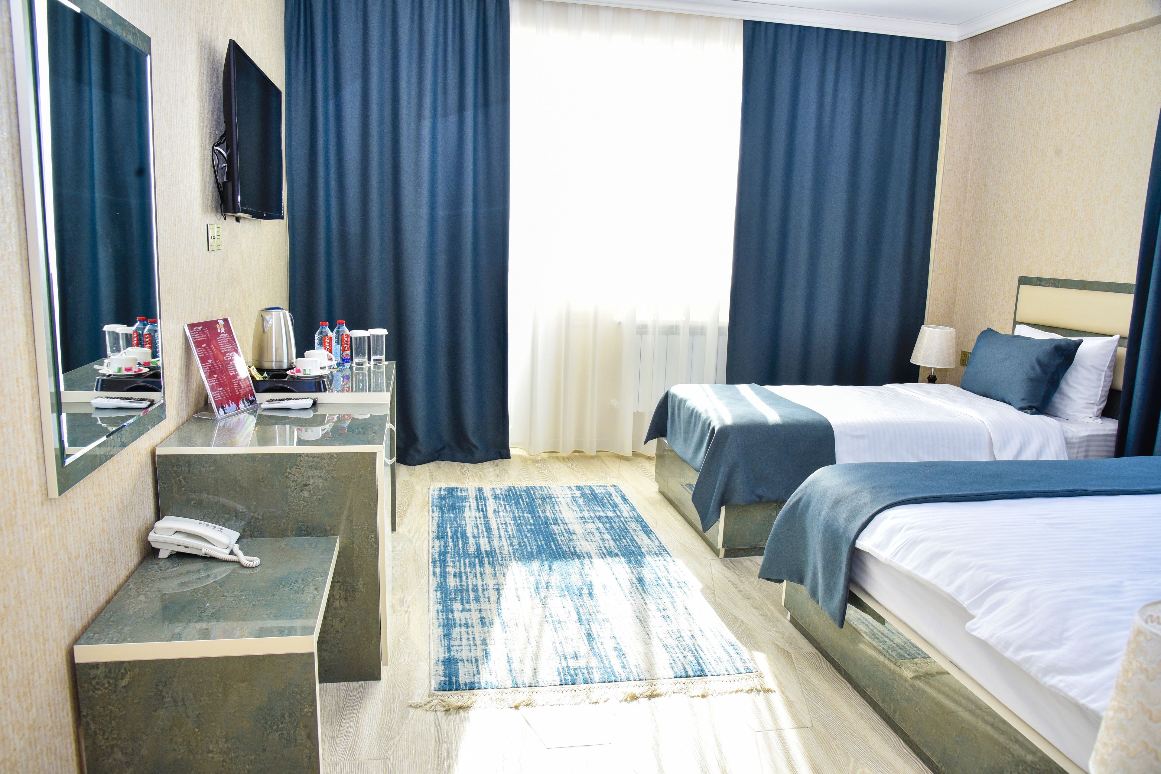deluxe room, 1 bedroom | in-room safe, desk, iron/ironing board, free cots/infant beds