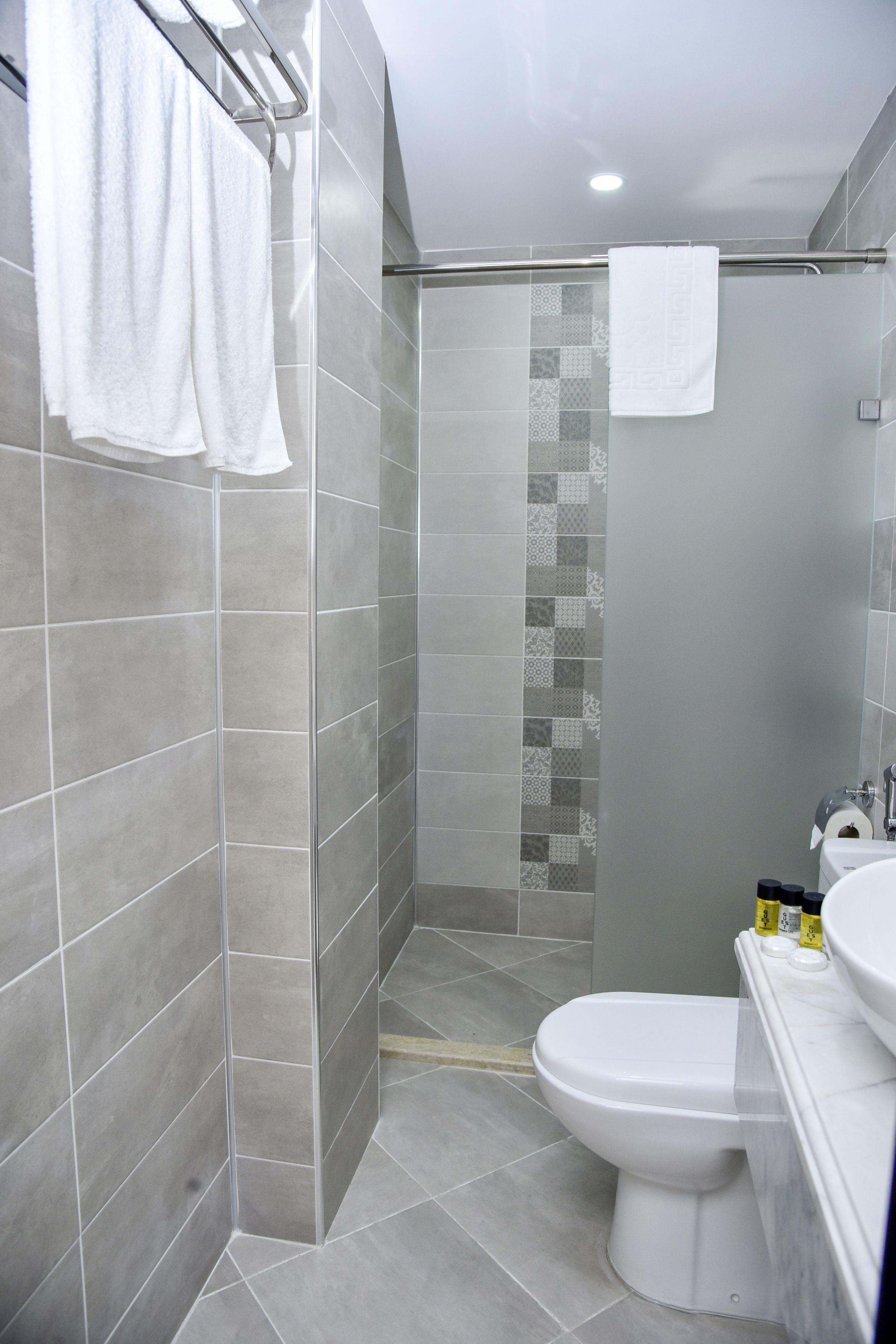 standard double or twin room | bathroom | shower, hair dryer, slippers, towels