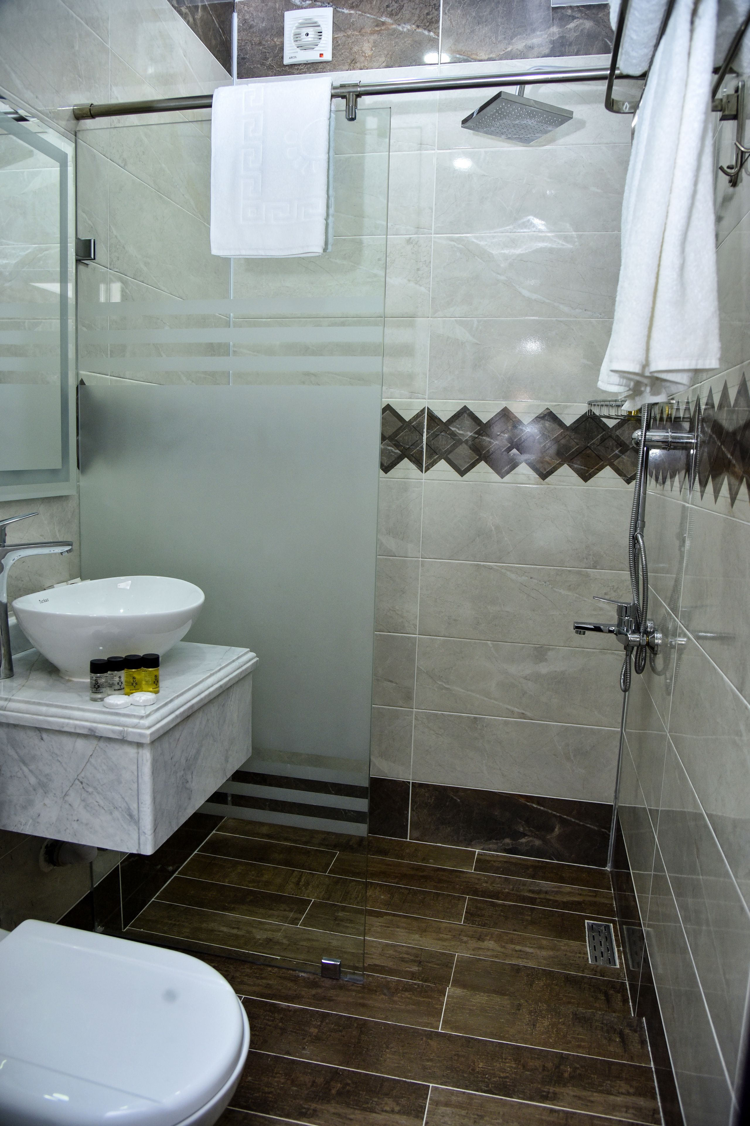 superior room | bathroom | shower, hair dryer, slippers, towels