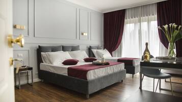 Deluxe Triple Room, Balcony | Minibar, in-room safe, desk, laptop workspace