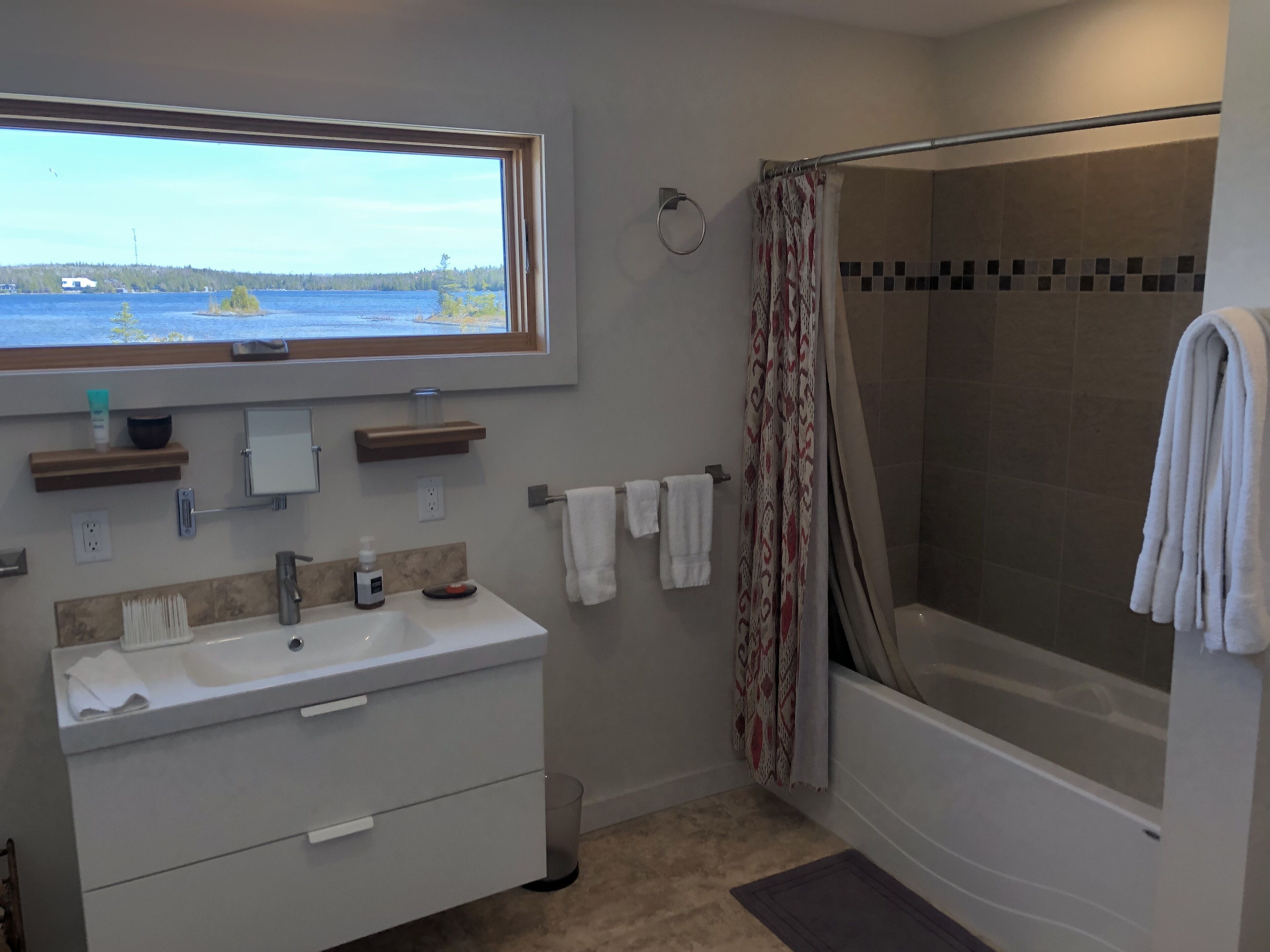 Combined shower/tub, hair dryer, towels, soap