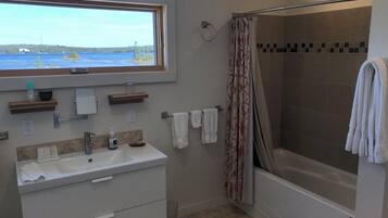 Combined shower/tub, hair dryer, towels, soap