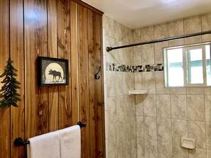 Combined shower/tub, hair dryer, towels, soap