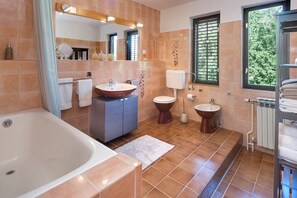 Bathtub, hair dryer, towels