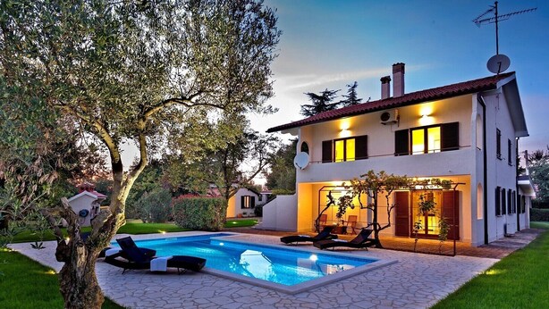 A modern two-story house with a swimming pool, outdoor seating, and a well-maintained garden. - ***Apartment with private pool and large garden (Nova Vas)