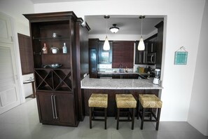 Apartment, Multiple Beds, Ocean View | Private kitchen | Full-size fridge, microwave, oven, stovetop - Whispering Seas (Tower Isle)