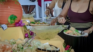 A buffet setup with various dishes and a large salad bowl. - La Fourmi Hôtel (Nosy Be)