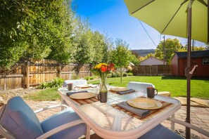 Outdoor dining - Highland Sage: Downtown Oasis, Private Fenced Yard and Relaxing Patio (Durango)