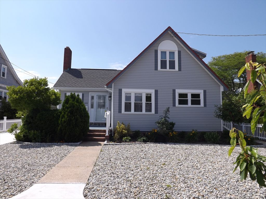 Enjoy a classic seashore vacation in this perfectly situated, rustic 4 BR, expanded cottage