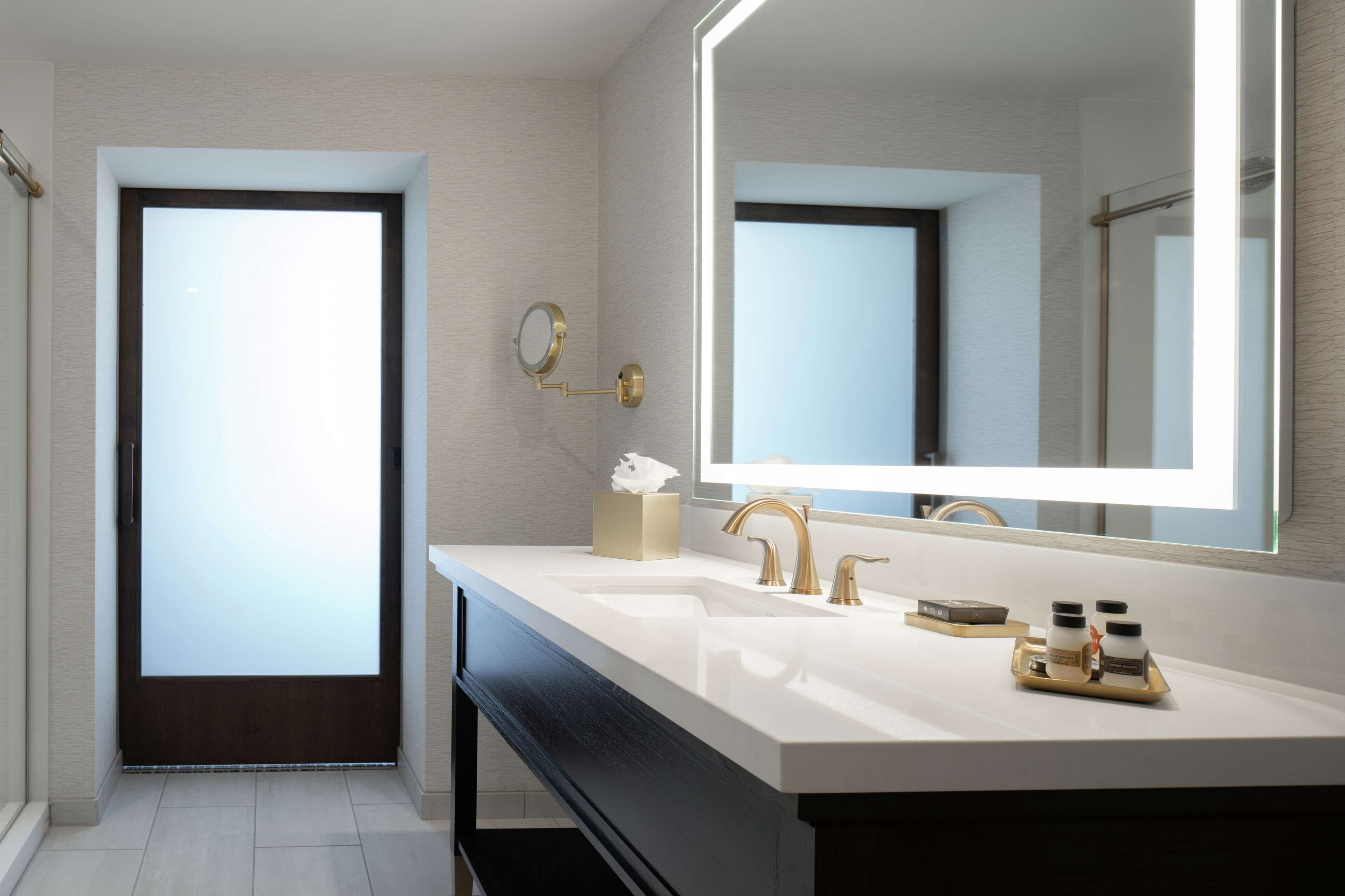 designer toiletries, hair dryer, bathrobes, slippers