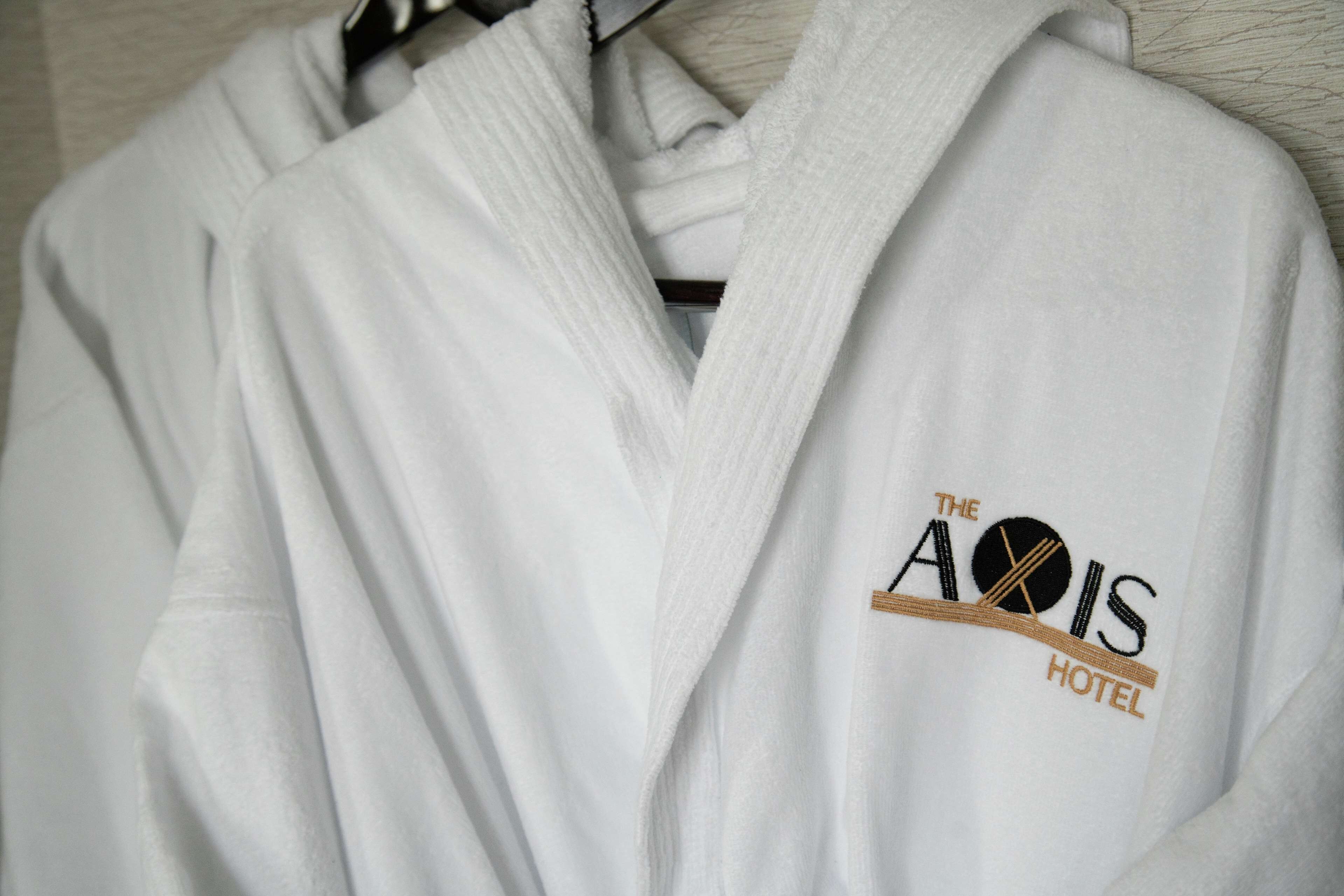 designer toiletries, hair dryer, bathrobes, slippers