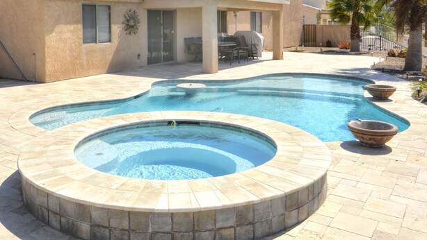 A swimming pool with a hot tub, surrounded by a patio area with outdoor furniture. - Poolside Panorama- Perfect Lake view (Lake Havasu City)