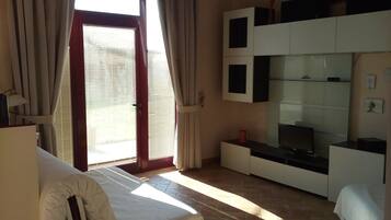 Apartment, 1 Bedroom, Annex Building (Antonio) | Living area | Flat-screen TV