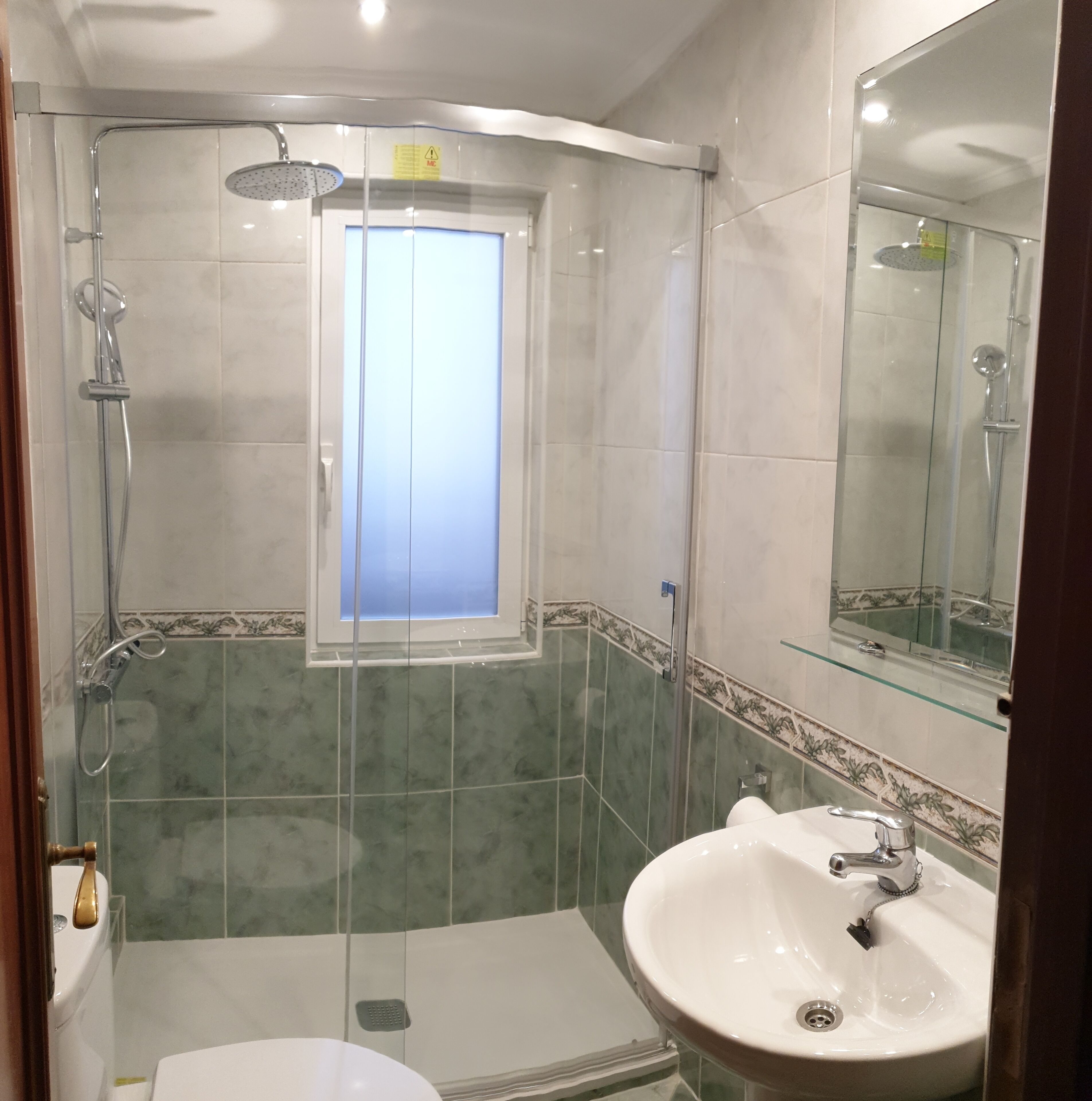 Shower, towels, soap, toilet paper